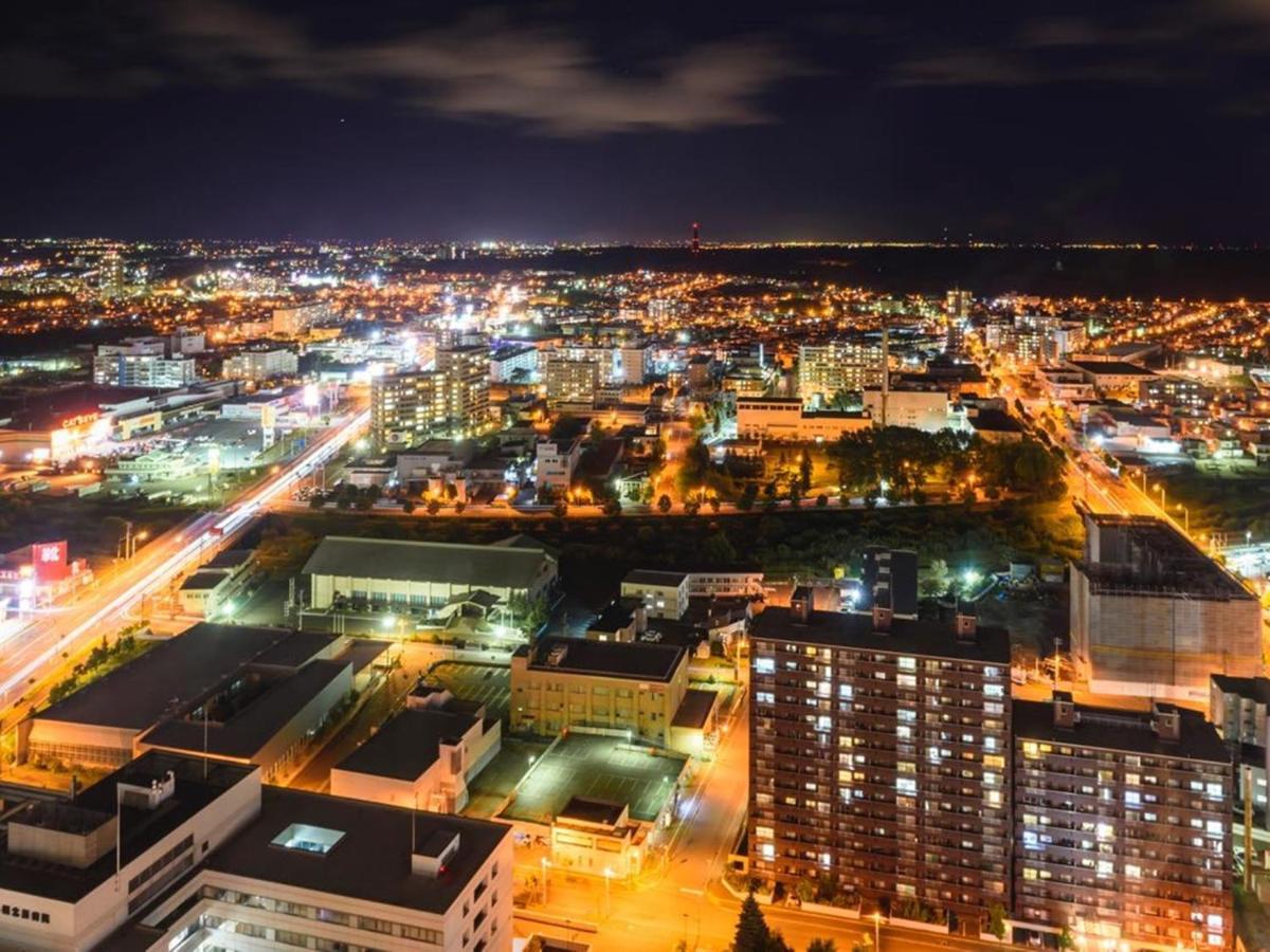 فندق إميسيا سابورو المظهر الخارجي الصورة Aerial view of the city at night